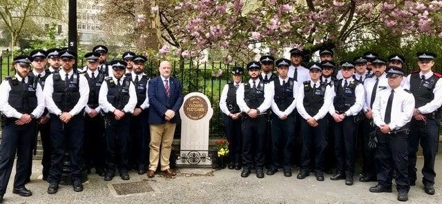 Group of police officers at WPC Yvonne Fletchers memorial stone min