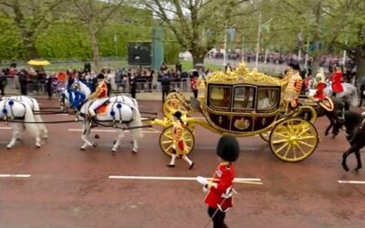 King Charles and Queen Camilla passing the National Police Memorial