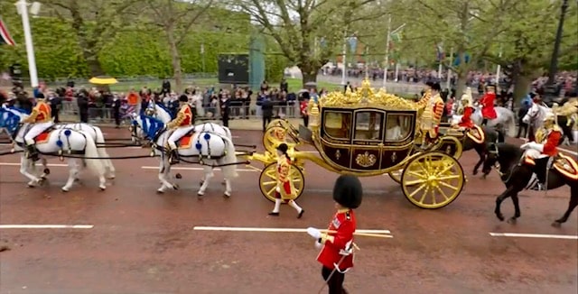 King Charles and Queen Camilla passing the National Police Memorial