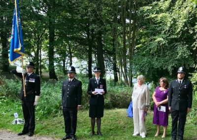 Police officers, family and Mrs Michael Winner at PC Haigh's Memorial